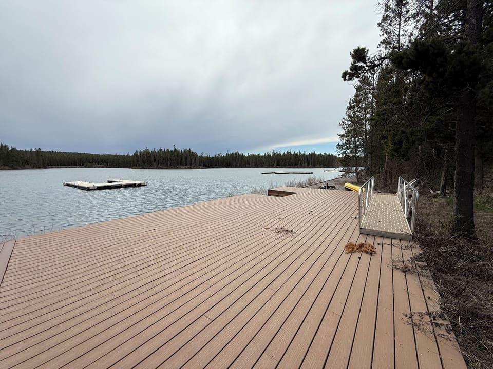 The is a private dock and boat dock on the waterfront property. 