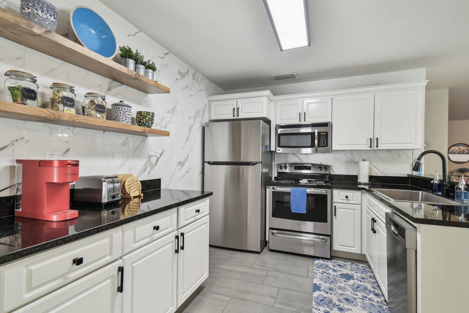Cook up delicious meals in the newly renovated, fully stocked modern kitchen