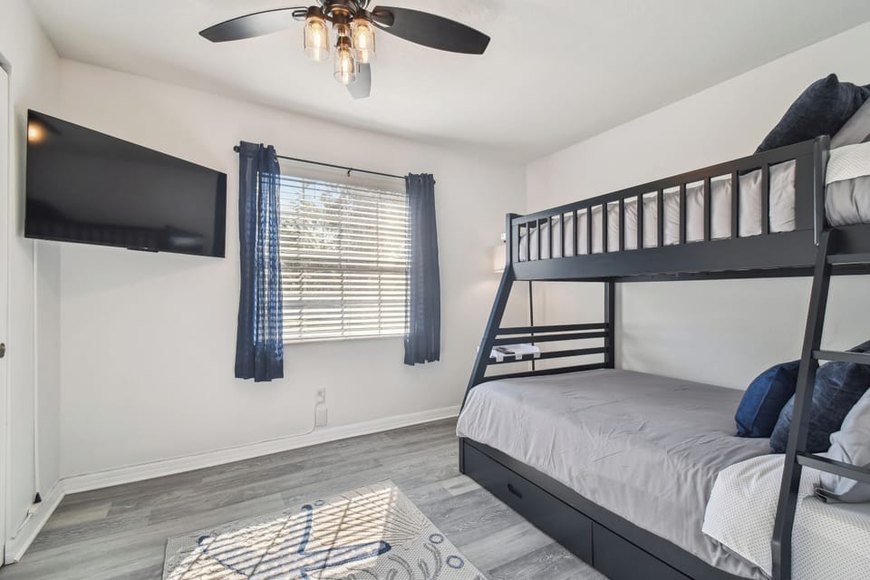 Cozy and comfy full/twin sized bunk beds with Roku tv and plenty of storage