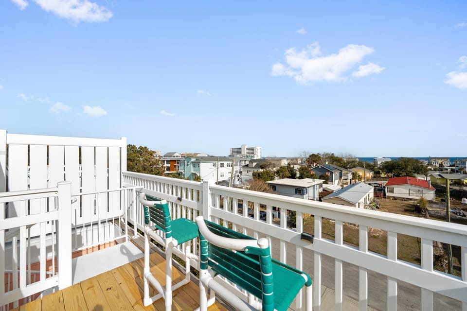 Step onto your private balcony and breathe in the coastal air while taking in sweeping neighborhood views from your elevated perch.