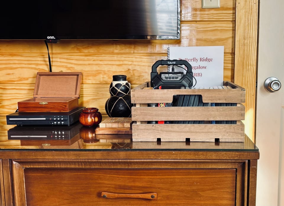 Bluetooth speaker, limited games and DVDs provided.