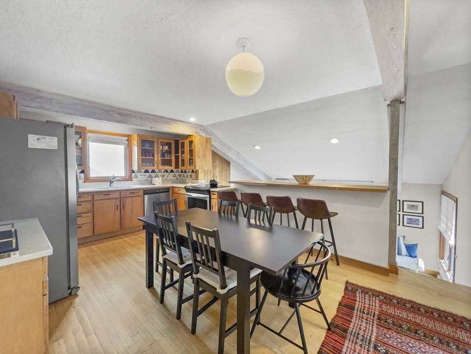 Kitchen dining area with steps to living room