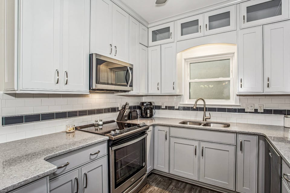 The kitchen is updated with granite counters and new cabinets
