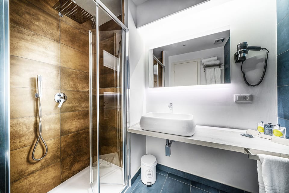 Family Triple Room | Bathroom | Hair dryer, bidet, towels, soap