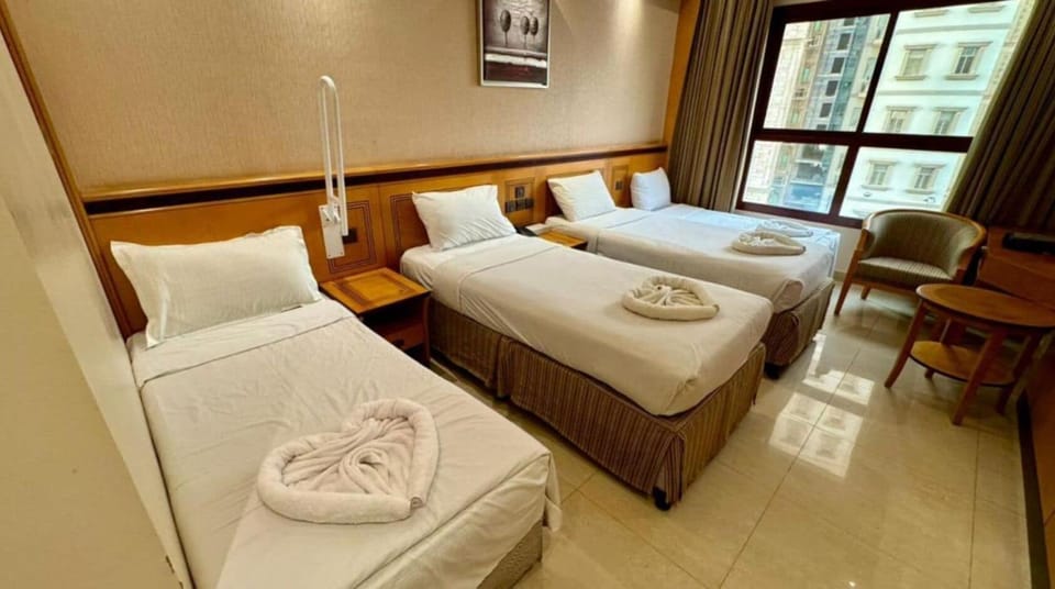 Basic Quadruple Room, City View | In-room safe, iron/ironing board, free WiFi, bed sheets