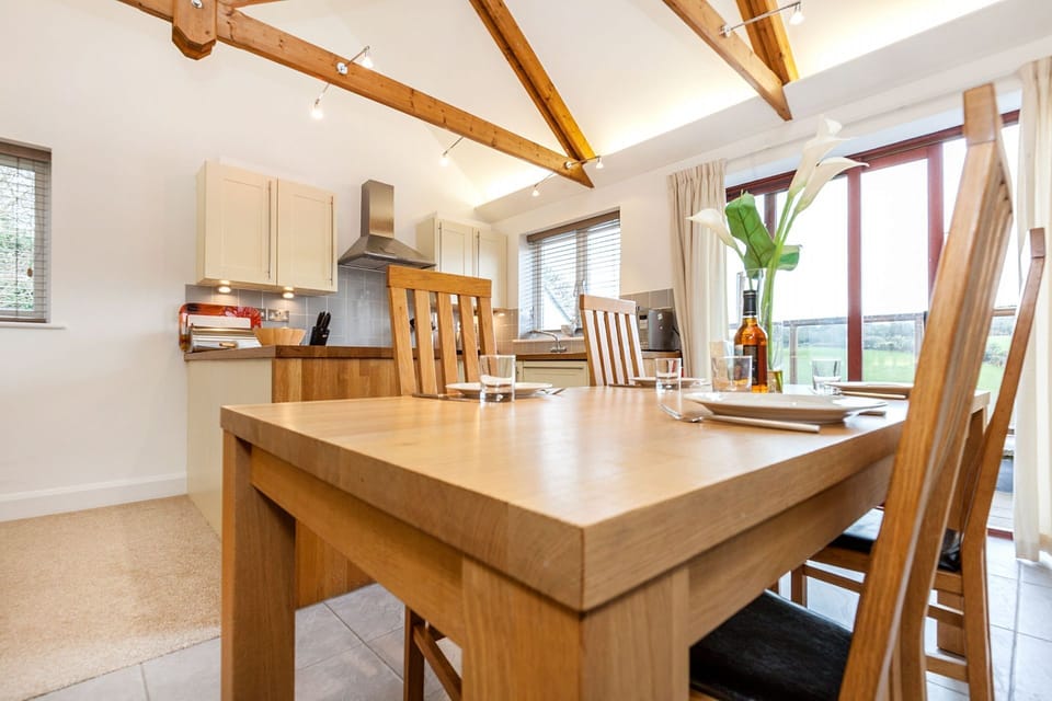 Mezzanine kitchen and dining space, leading to balcony
