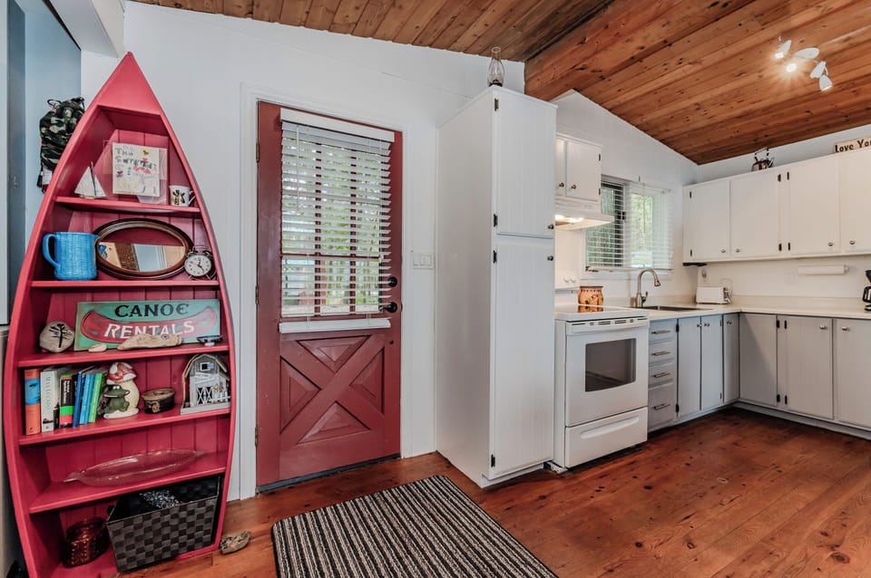 Cook up vacation meals in this full kitchen, featuring vintage charm, modern appliances, and fun lake-themed touches.
