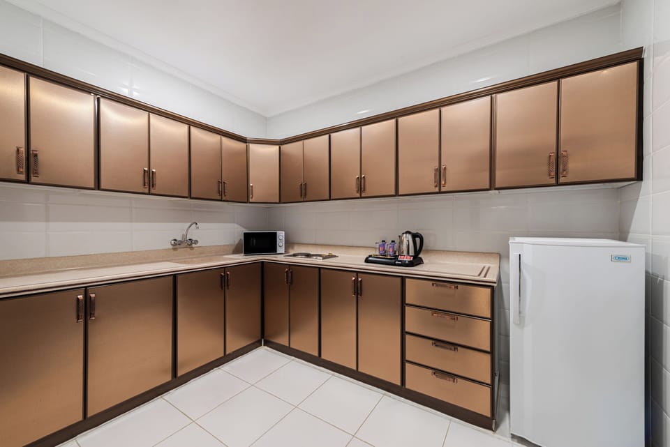 Family Suite, City View | Private kitchen | Mini-fridge, stovetop, electric kettle