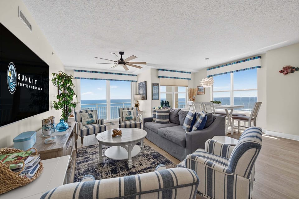 Living room and dining room offering all the ocean views