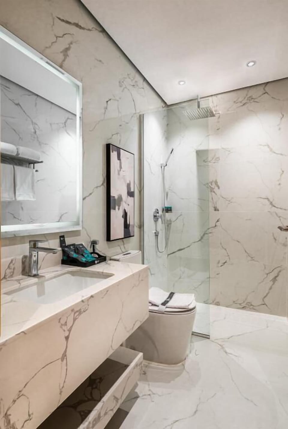 Rainfall showerhead, designer toiletries, hair dryer, slippers