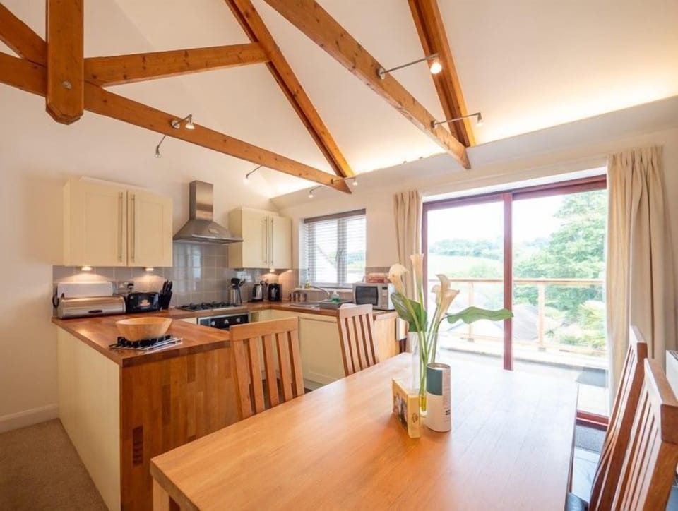 Balcony connecting to large open plan kitchen and dining area