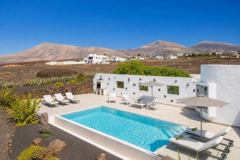Private pool, terrace, and garden with panoramic sea views