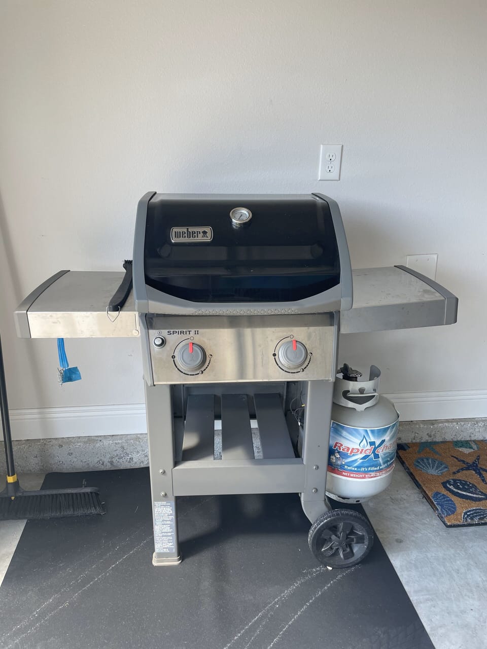 Gas grill with grilling utensils