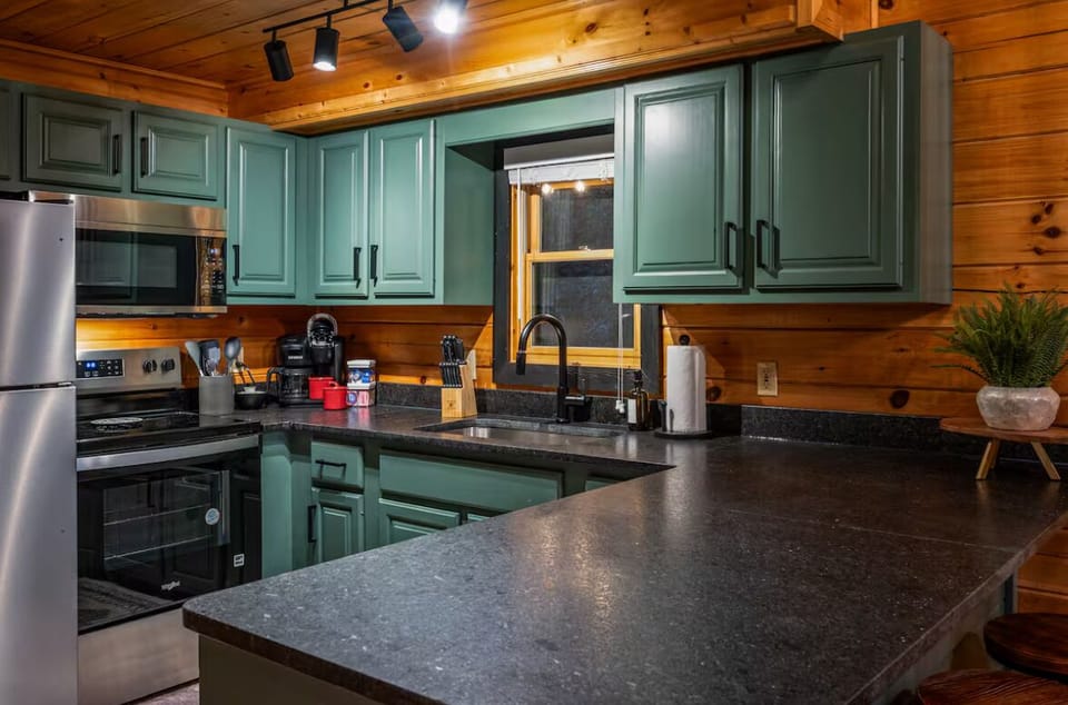 Custom countertops and hand painted cabinets, a home cooks dream!