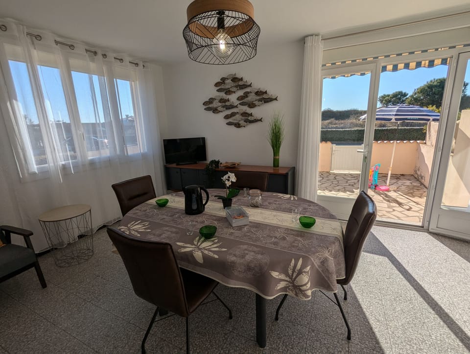 Bathroom equipped with a walk-in shower, many storage spaces and a towel dryer for more comfort