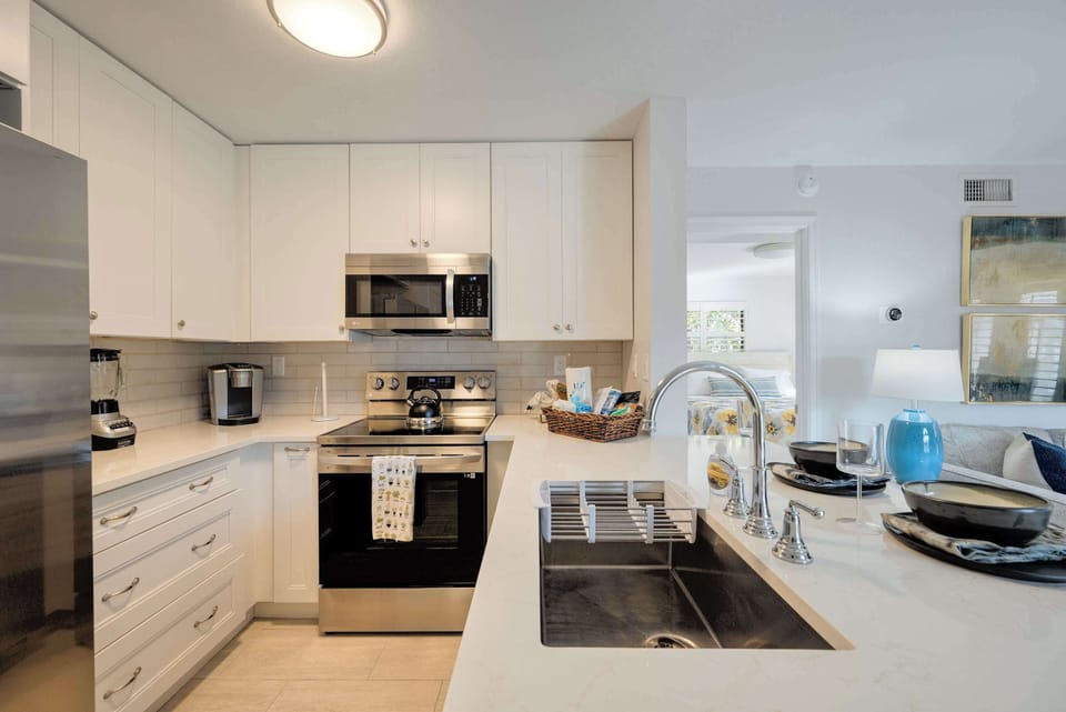 Full size refrigerator, sink, microwave, over, and electric range