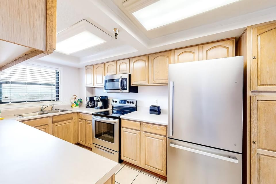 Condo, Multiple Beds (Emerald Surf 106) | Private kitchen | Oven, toaster