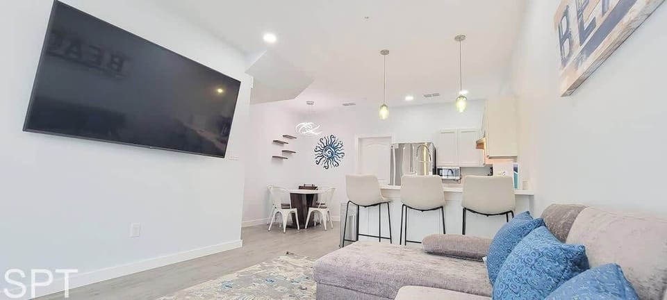 Condo, Multiple Beds, Kitchen, Garden View (Villas de Laguna 3) | Living area | 75-inch flat-screen TV with digital channels