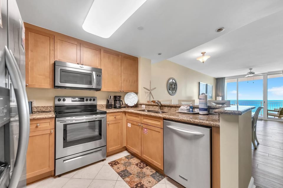 Condo, Multiple Beds (Aqua Resort 1207) | Private kitchen | Oven, toaster, cookware/dishes/utensils