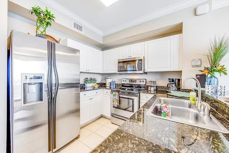 Condo, Multiple Beds (Tidewater 913) | Private kitchen | Oven, cookware/dishes/utensils