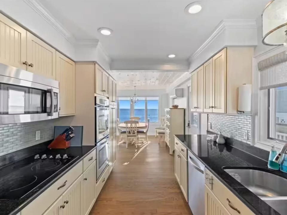 Full kitchen with all new pots, pans, glasses, silverware and plates.
