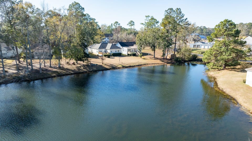 Tall Timbers outside view with the pond