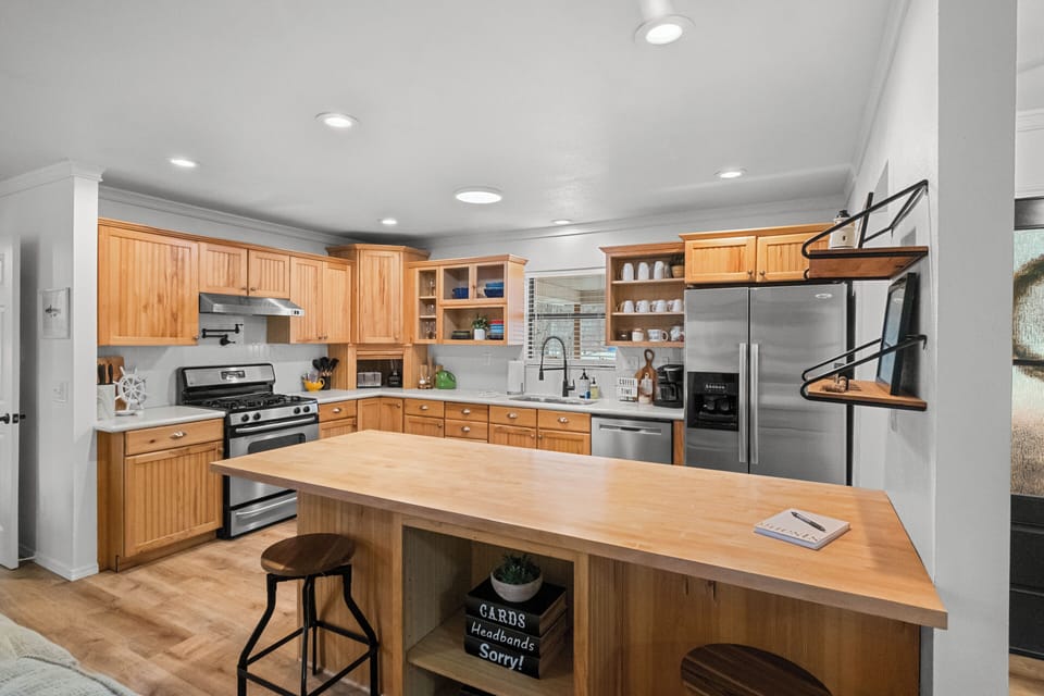 Seating for 2 at the bar! Plus games in the island shelves for you to enjoy!