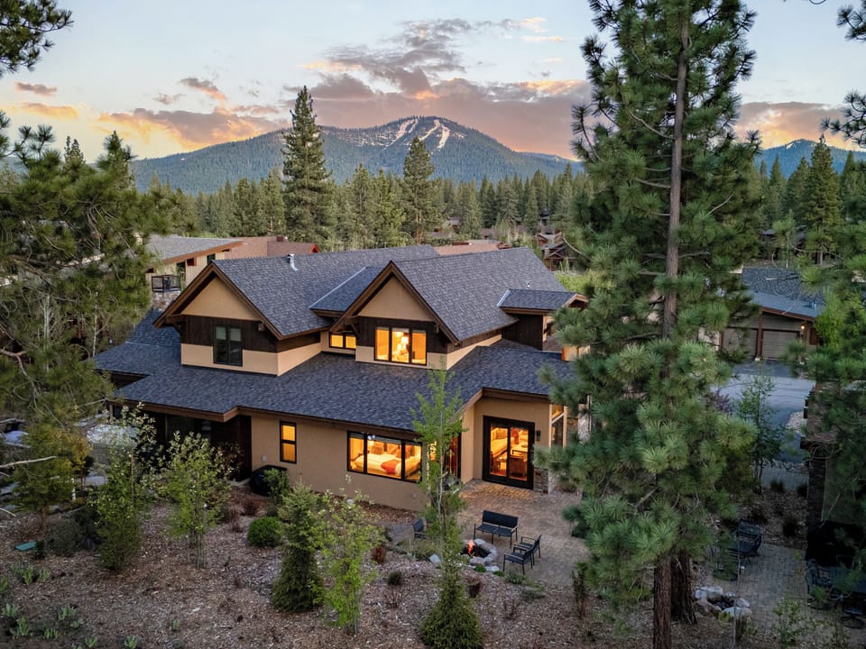 Breathe in the crisp mountain air as you relax on the spacious patio, complete with a natural gas BBQ for easy outdoor cooking, a large umbrella for shade, and a cozy gas firepit—perfect for u