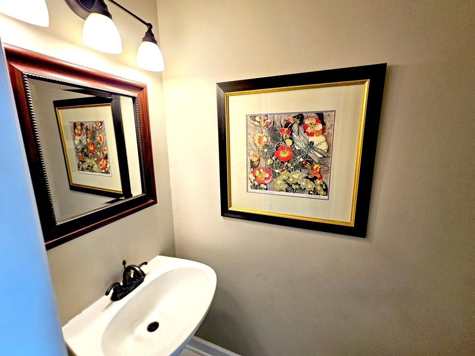 The easily accessible half-bath offers convenience and efficiency for larger groups and extra guests.