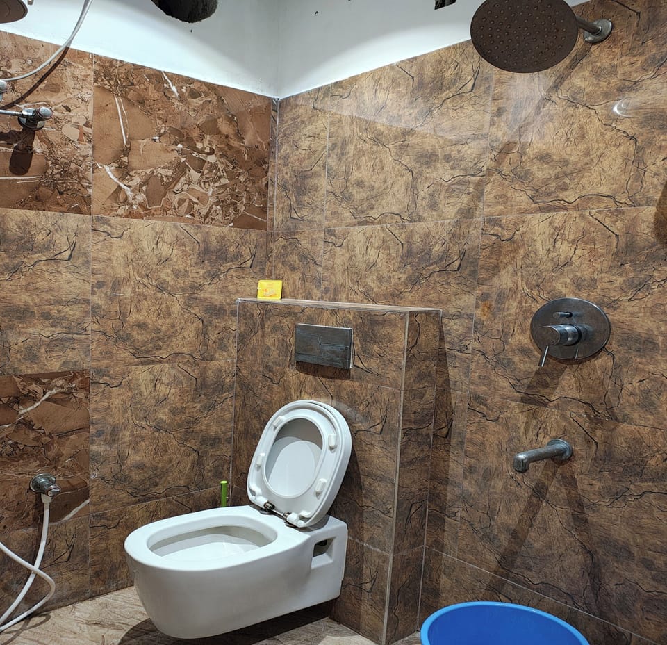 Shower, rainfall showerhead, towels, soap