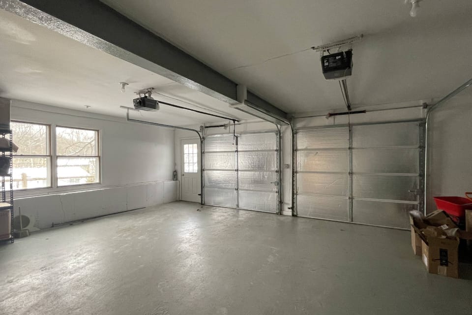 Spacious two-car garage offering secure parking and extra storage for your convenience