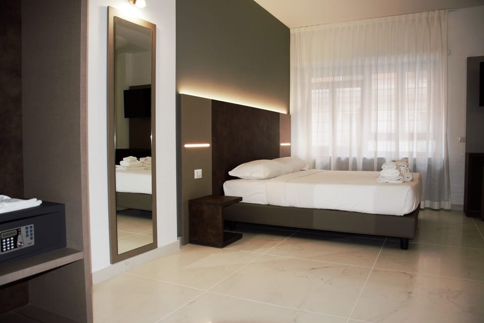 Standard Triple Room | In-room safe, desk, laptop workspace, blackout drapes