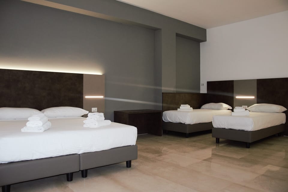 Luxury Quadruple Room | In-room safe, desk, laptop workspace, blackout drapes