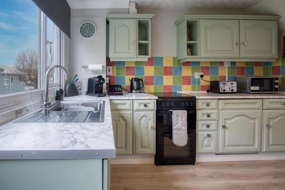 Chalet (2 Bedrooms) | Private kitchen | Microwave, oven, dining tables
