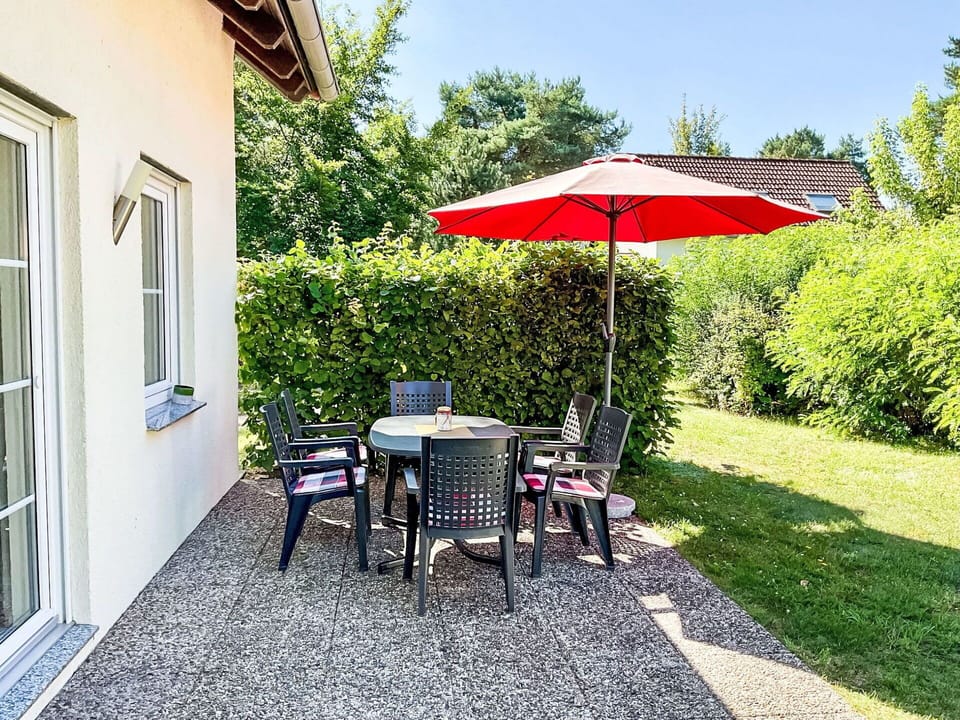 Furniture, Outdoor Furniture, Chair, Shrub, Garden, Outdoor Table, Table, Groundcover, Shade