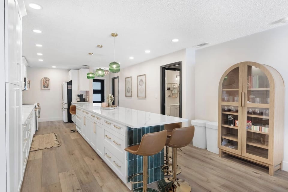 Massive Open Kitchen with 15-foot Quartz Island (seating for 12), Luxury GE Cafe Appliances. Fully stocked for large group, Games, Open to Living Room 