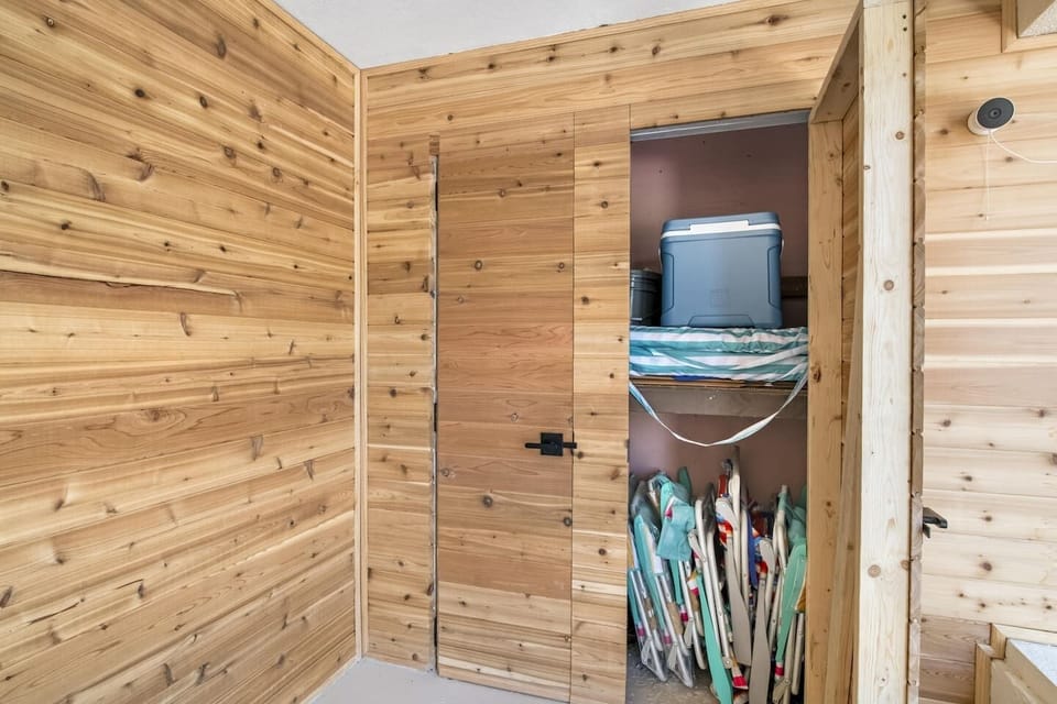 Outdoor closet stick with beach supplies. 