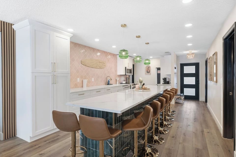 Massive Open Kitchen with 15-foot Quartz Island (seating for 12), Luxury GE Cafe Appliances. Fully stocked for large group, Games, Open to Living Room 
