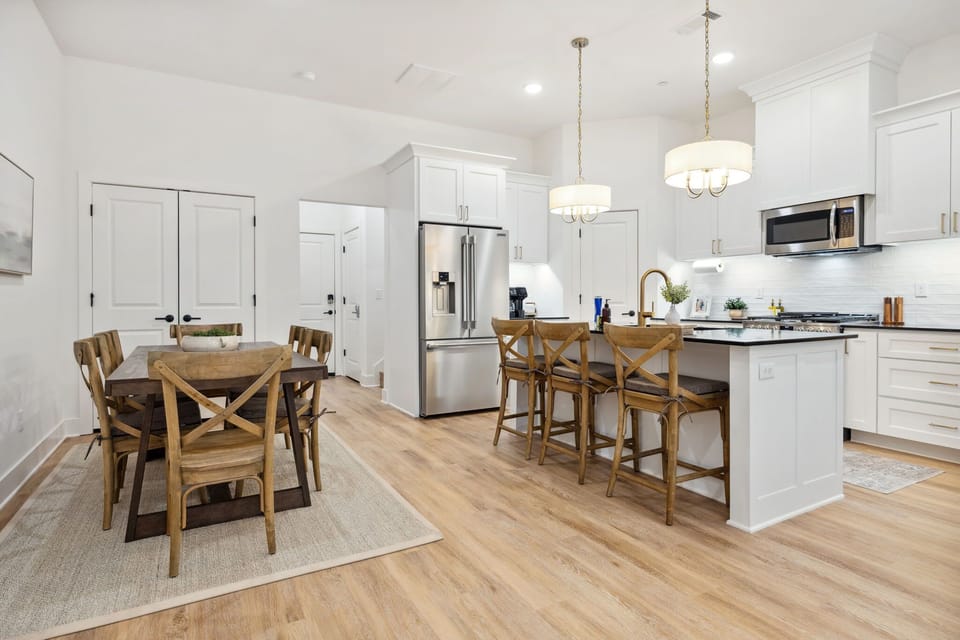  The living area is modern and open with a fully stocked kitchen and dining area