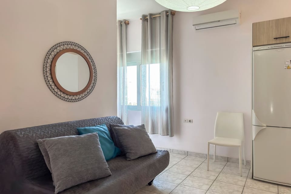 Basic Apartment, 1 Queen Bed with Sofa bed, Balcony, Beachfront | Living area | Flat-screen TV