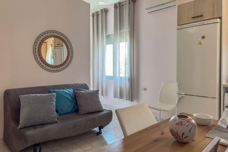 Basic Apartment, 1 Queen Bed with Sofa bed, Balcony, Beachfront | Living area | Flat-screen TV