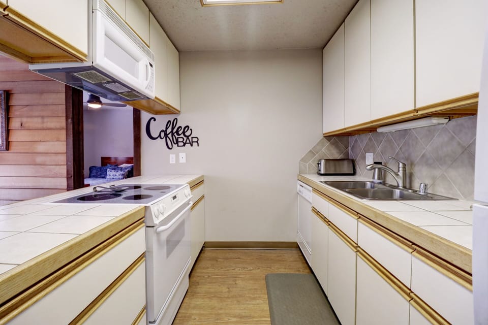 Condo, 2 Bedrooms | Private kitchen | Fridge, coffee/tea maker