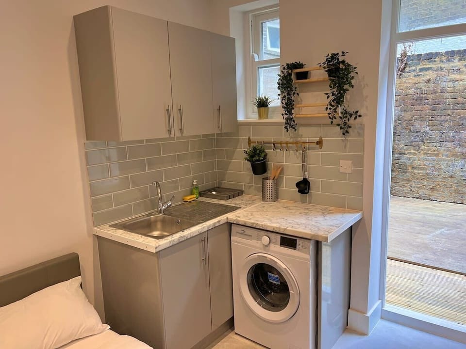 Unwind in this smartly designed kitchenette