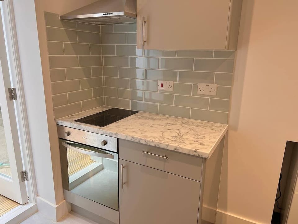 Experience culinary delight in this sleek kitchen