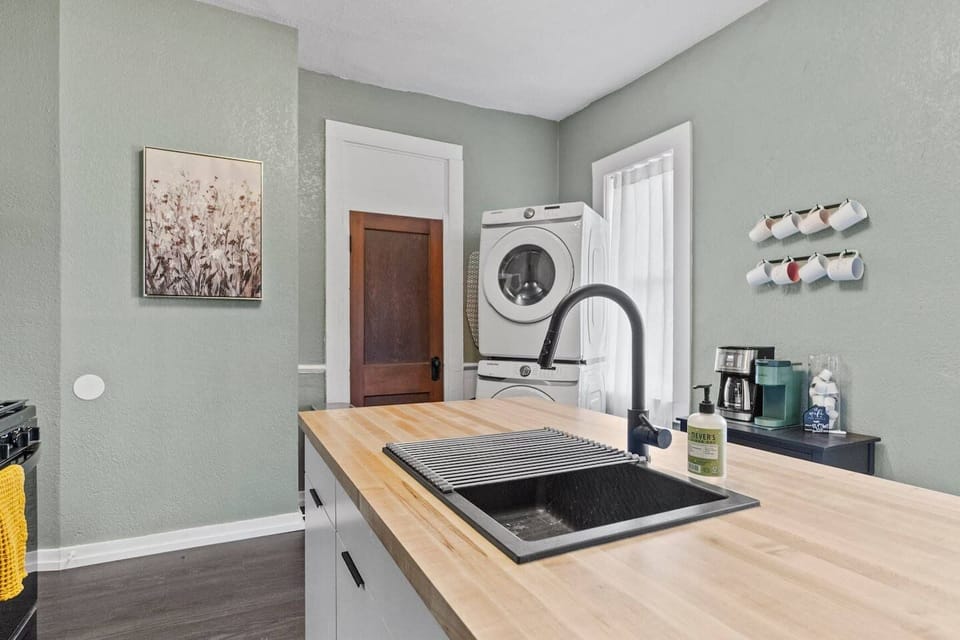 Fuel your morning at the dedicated coffee bar complete with a Keurig, right next to the stacked in-unit washer and dryer for ultimate convenience during your stay.