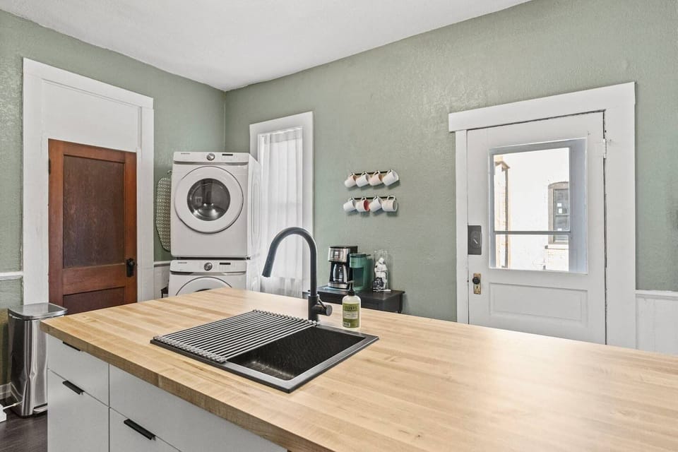 Toss a load of clothes into the laundry while rinsing dishes at the central island sink, perfectly positioned for multitasking during group trips to Fort Wayne.