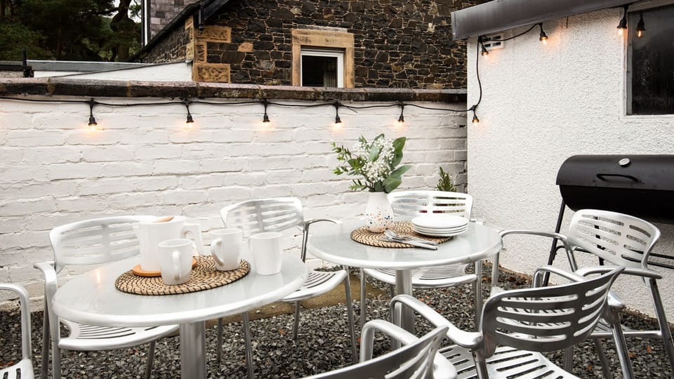 Dalgety - garden seating in the courtyard to the rear of the house