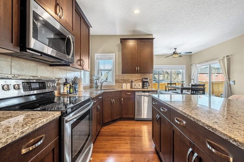 Stainless steel modern appliances have it all for the discerning guest