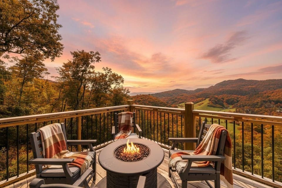 Cozy outdoor seating with a fire pit overlooking autumn mountains at sunset