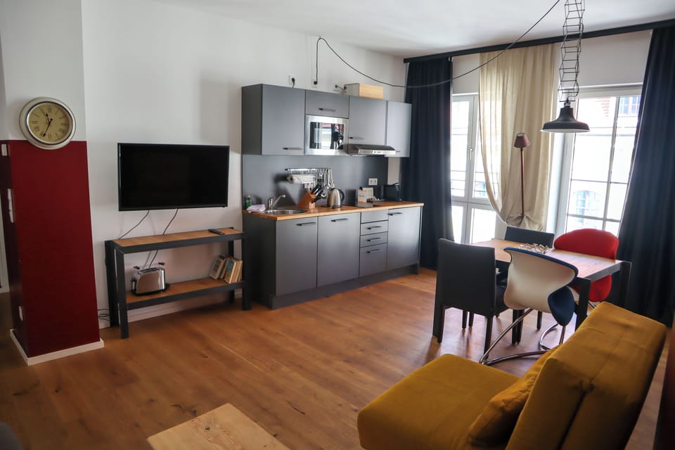 Family Apartment | Living area | 45-cm flat-screen TV with cable channels, books, heated floors